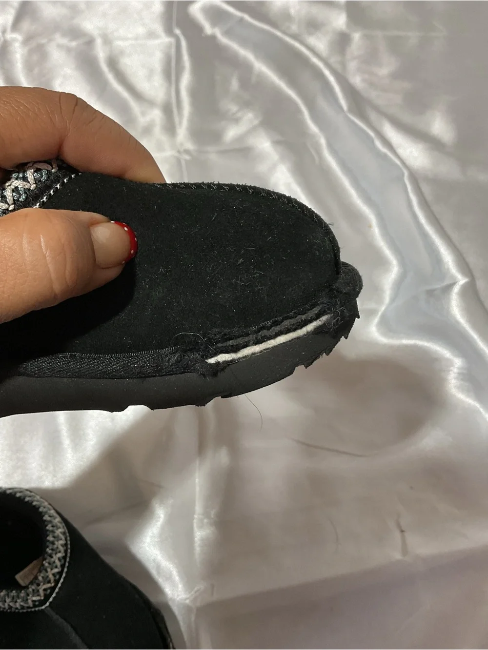 Kids Black Cozy Slip-On Shoes with Decorative Trim It is torn to shreds—heaps of